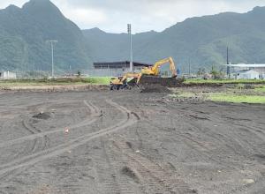Heavy duty machinery leveling building site