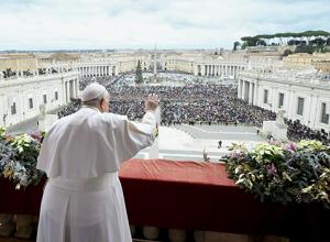 Pope Francis waves to an estimated 70,000 people gathered in St. Peter's Square at the Vatican for his Christmas blessing "urbi et orbi" (to the city and the world) Dec. 25, 2023. (CNS photo/Vatican Media) Pope Francis waves to an estimated 70,000 people
