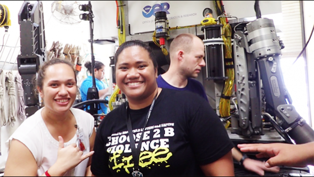 Left is Ms. Ruby Tapua'i (ASCC Science Lab Technician and Marine Science graduate from U.H. Hilo) and right is Ms. Claudia Thompson in front of the NOAA R/V Okeanos Explorer Remotely Operated Vehicle that is used to explore our ocean depths.  Claudia is currently participating in an internship with the NOAA Office of Ocean Exploration. [Photo: K. Anderson-Tagarino]
