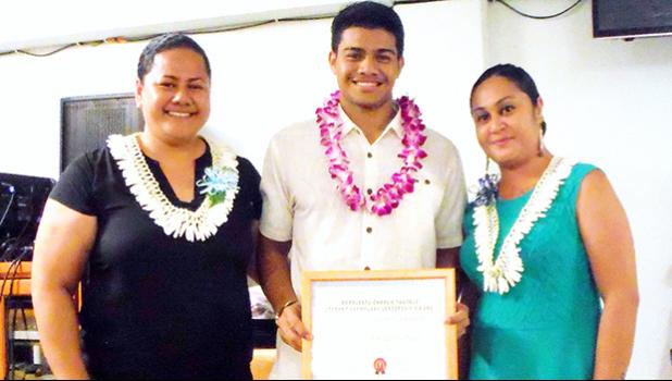  Ionatana Tuitasi received the McDonalds Scholarship from McDonalds American Samoa representatives Delores Tautolo and Katie Afuamua.