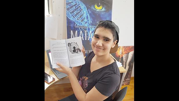 Bella Young displays one of her illustrations