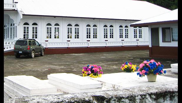 It was clear during the press conference that it’s the wish of Task Force chair, Lt. Gov. Talauega E.V. Ale that families be allowed to hold funerals for their loved ones while at the same time the public is protected from the community spread of the virus. graves near a house and church