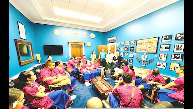 close up delegates in Amata's office