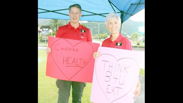 Elder Dr. Melvin Eric Carter and his wife Nurse Practitioner Sister Allison Carter promoting Heart Month during a morning wave this past year. The two were bid a heart-felt farewell at a luncheon hosted by LBJTMC, last week, as their healthcare volunteer work through the LDS Missionaries volunteer program comes to an end. Dr. Melvin Eric Carter and his wife Nurse Practitioner Sister Allison Carter