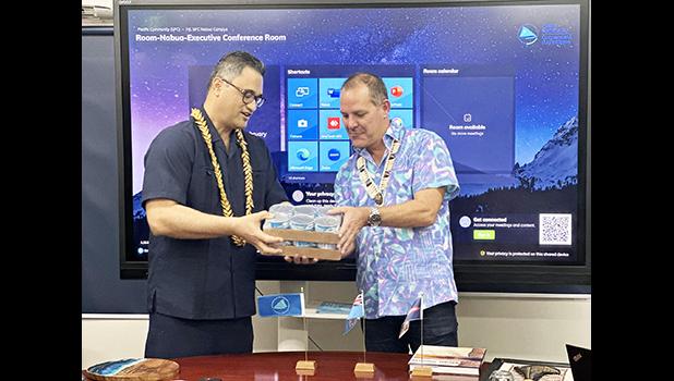 Lieutenant Governor and Director General Dr. Stuart Minchin of SPC exchanging gifts after the meeting. LT GOV AND Dr. Stuart Minchin