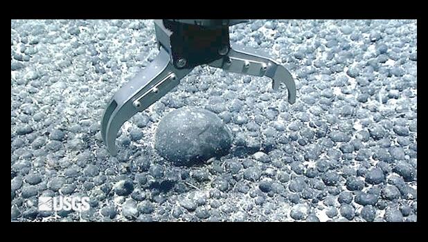 mechanical claw picks up nodule
