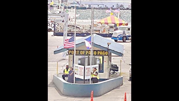 American Samoa and U.S. flags at half staff at Port.