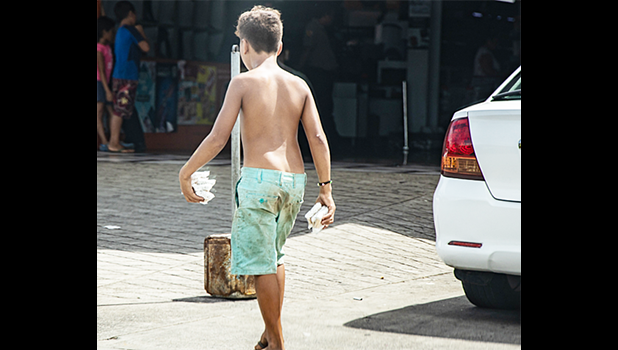 Child vendor on a street in Apia