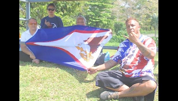 Supporters with Am Samoa flag