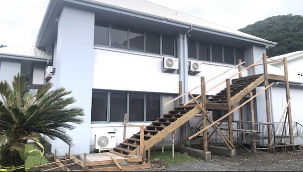 wooden stairway being built onto District Court building