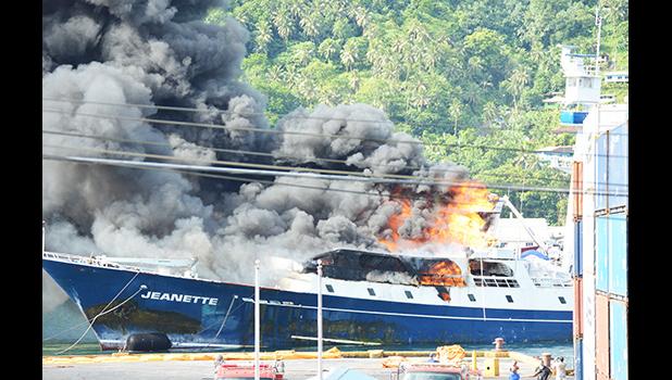 Fishing vessel Jeanette on fire at the dock in Pago Pago harbor