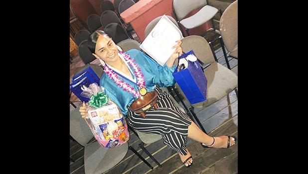 2019 Samoan High School graduate, Lessei Perelini, who also served at the time as president of the student body association, posed in this undated photo distributed by South Pacific Islander Organization (SPIO). Lessei Perelini with her awards
