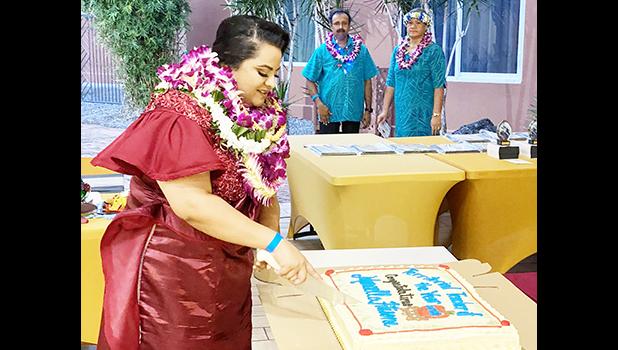 Ms. Marcella Fitisone CUTTING CAKE