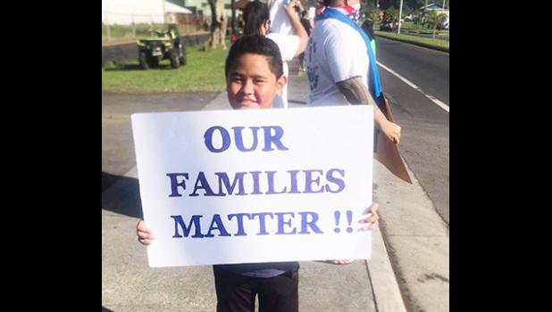 Young demonsrator at Saturday's rally for stranded residents.