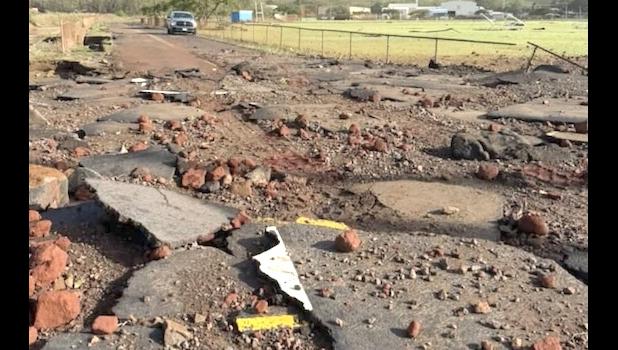 Road damage n Hanapēpē, Hawaii, following Hurricane Lowell