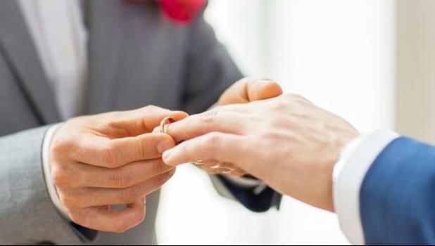 Photo of men's hands with wedding rings