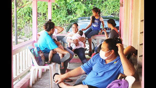 Members of the public talk outside the Faga’alu DOH Health Clinic