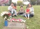 Michael Pese (left) and Tupe Smith (right) with their three children