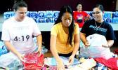 ASCC Student Government Association president Christina Toilolo (center) sorts through donated clothing, with assistance from Jennifer Si’ilata (left) of Operation Love, during the College’s assistance drive last week for students affected by Cyclone Gita.  [Photo: J. Kneubuhl]