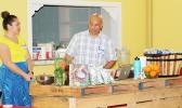 Master Chef Kenneth Kuala and his beautiful assistant and wife, Luisa, demonstrate for members of the Facebook weight-loss group SSY-Slimmer Stronger You, how to cook and make sauces and salad dressings using healthy, locally grown ingredients. The demonstration was part of the first ever SSY Meet & Greet event that took place December 8 at the VA Center in Tafuna.