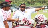 Tafuna Warriors head coach pointing towards the Vikings sidelines and encouraging his Warriors during a time out of a JV game against the Vikings last Saturday morning, where Tafuna smashed Faga’itua in a 24-0 shut out JV victory.  [photo: TG]