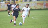 Eliza Berondo of Amercan Samoa dribbles the ball