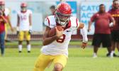 Tafuna Warriors quarterback Oakland Salave’a scrambling