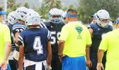 Samoana Sharks head coach, Pati Pati giving advice to his defensive unit 