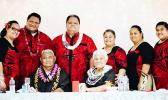 This  family photo shows the late Rev. Elder Dr. Pati Puia’i Vaeao sitting next to his wife of 47 years, Siafiafilelei Thompson Leasau, surrounded by family members