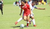 Saono Enesi of American Samoa dribbles the ball