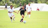 Saono Enesi of American Samoa, right, dribbles away