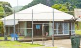 Following the interview, authorities booked the suspect and transported her to the Tafuna Correctional Facility, where she was confined pending her appearance before the District Court. TCF women's building
