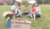 Michael Pese (left) and Tupe Smith (right) with their three children